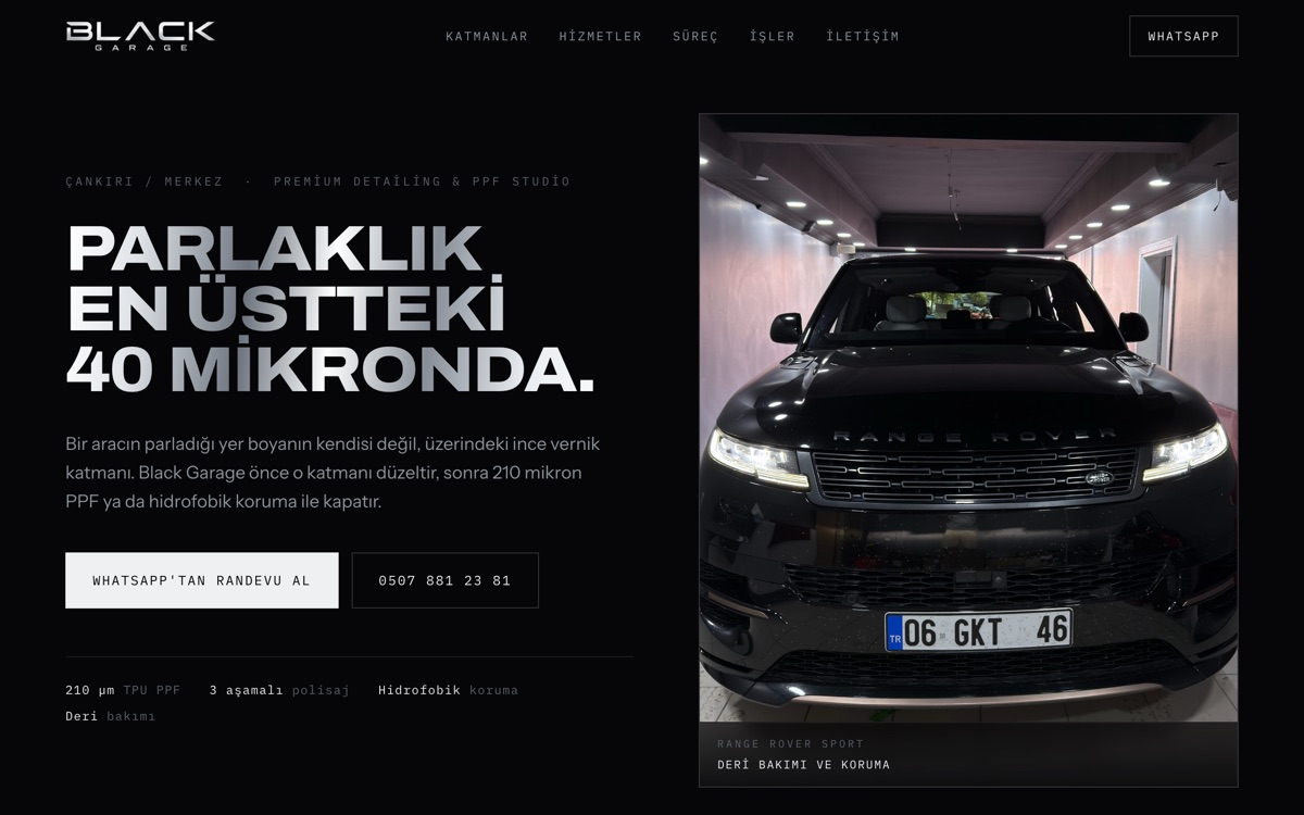 Black Garage sitesinin giriş ekranı: siyah zemin üzerinde bakımı yapılmış bir Range Rover.